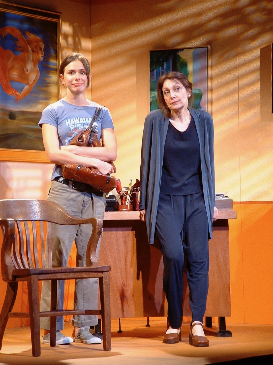 Two performers sharing a dryly comic moment in Naked With Fruit
