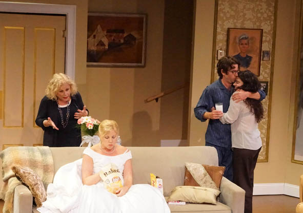 Four performers sharing a complicated family moment in Reasons to Live