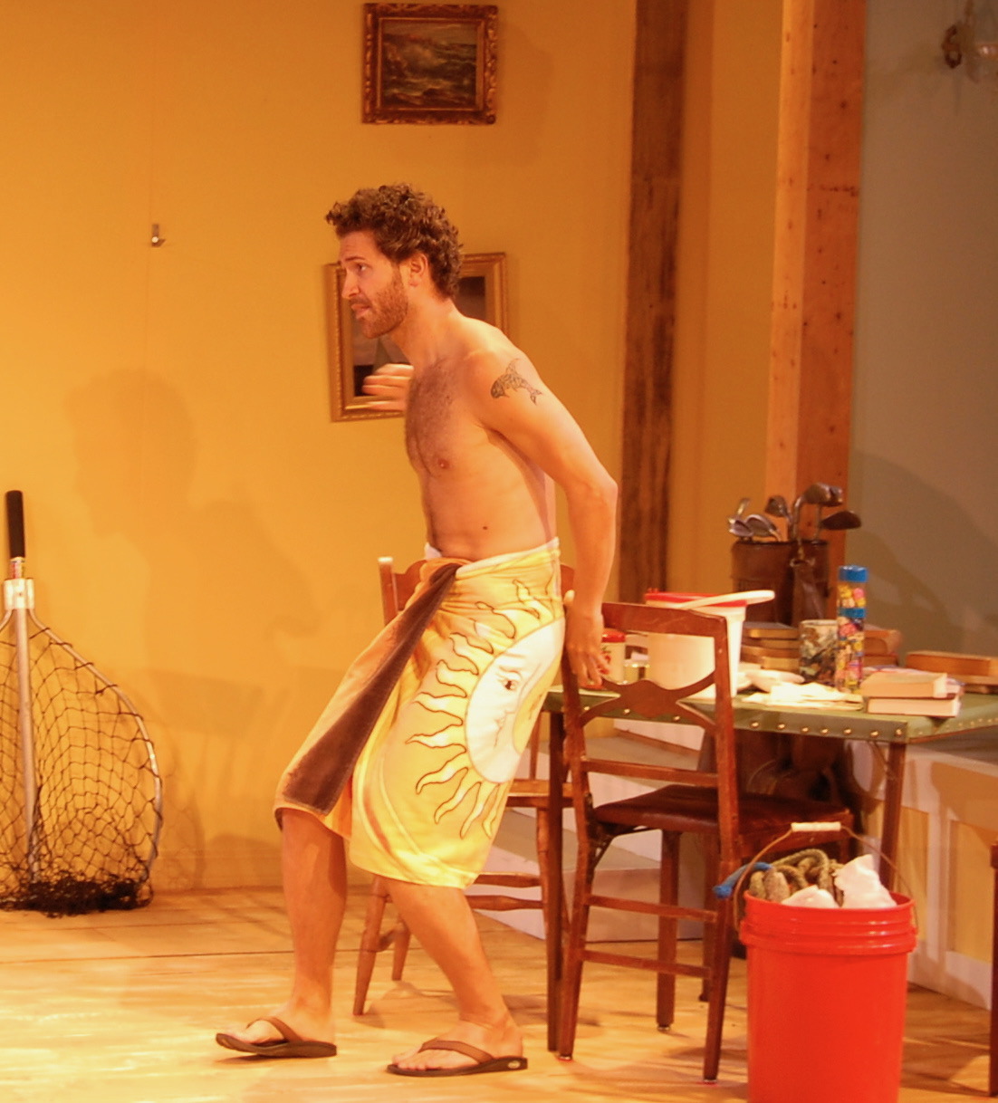 A performer crossing the Montauk house set in The Siegels of Montauk