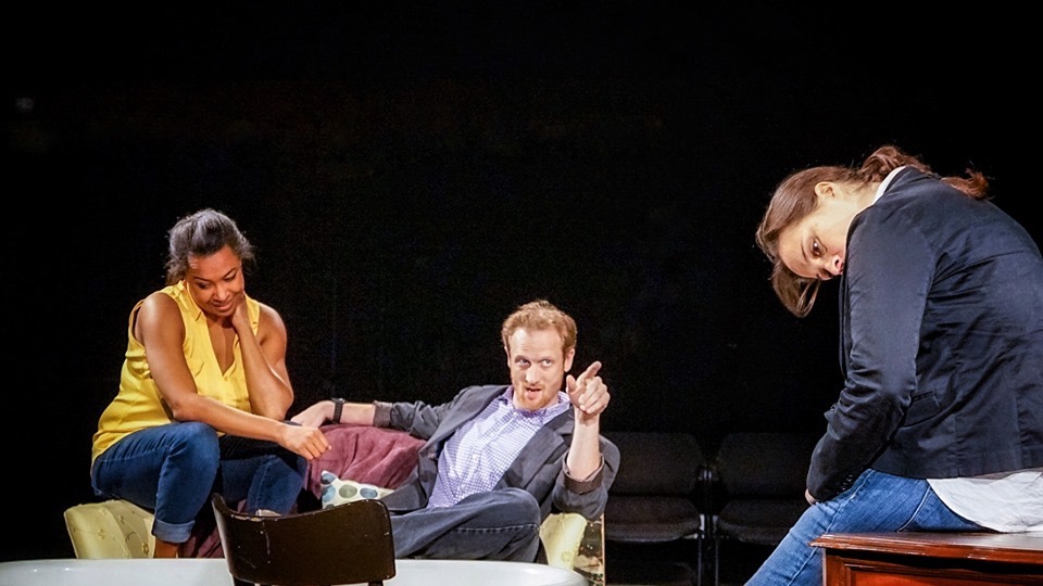 Three performers sharing a comic moment in The Final Say