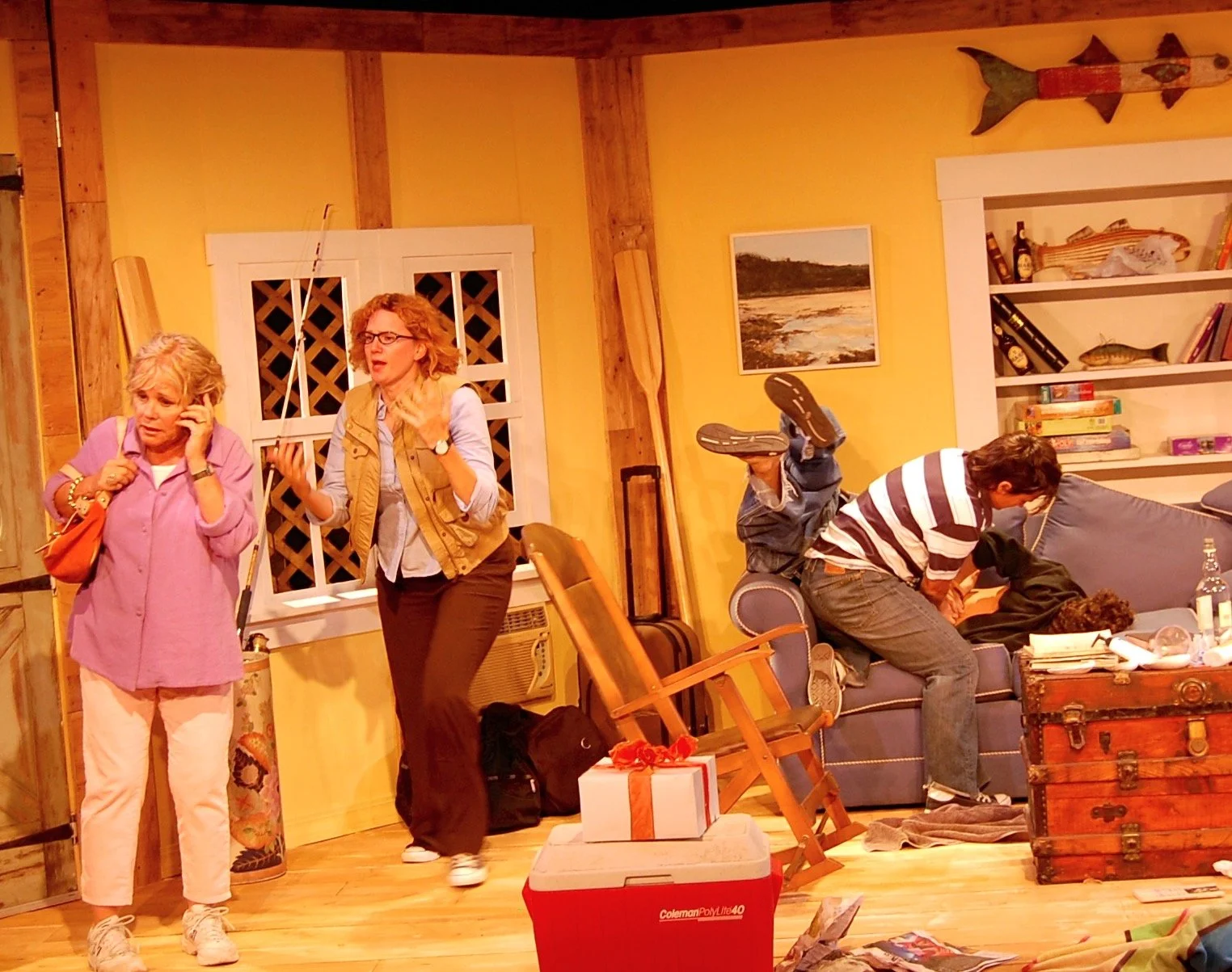 Four performers in a lively beach-house scene from The Siegels of Montauk